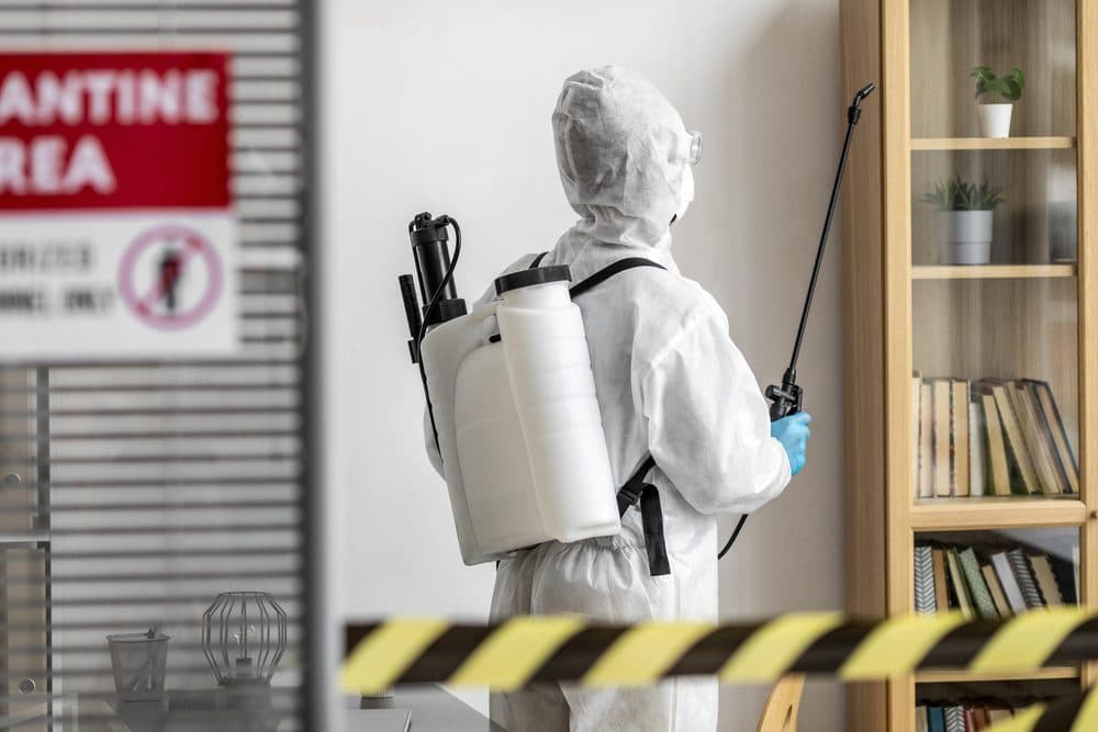 Biohazard Cleaning by Clear Pest Control Clear Pest Control biohazard cleaning technician decontaminating a restricted area in North East England