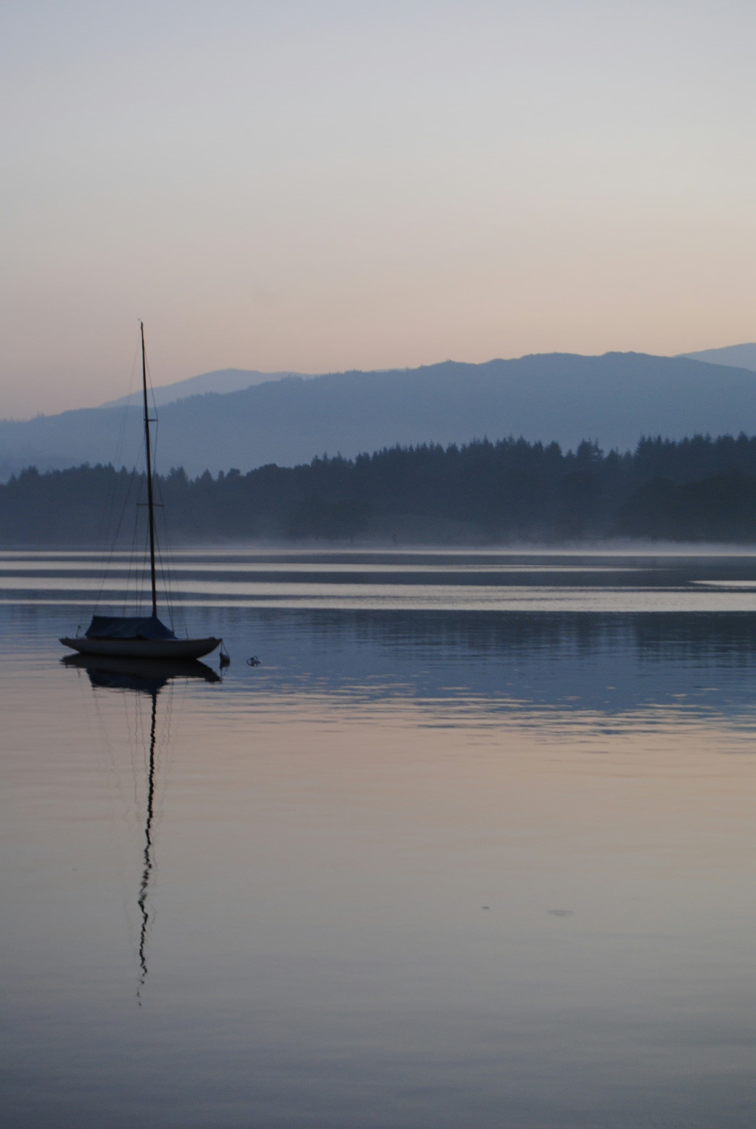 Pest Control in Keswick | Clear Pest Control Sailing boat on a misty lake near Keswick, served by Clear Pest Control across Cumbria