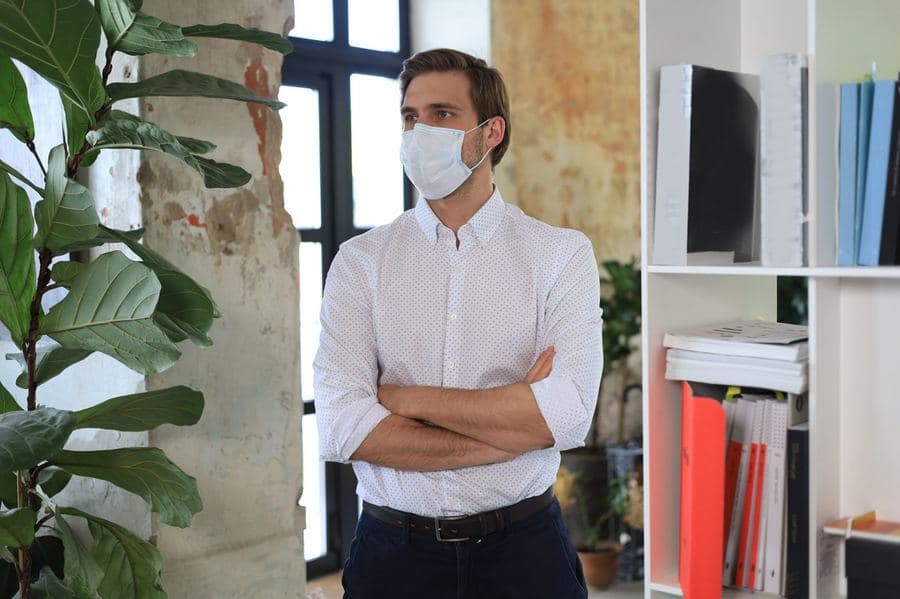 Pest control area manager inspecting a commercial indoor environment